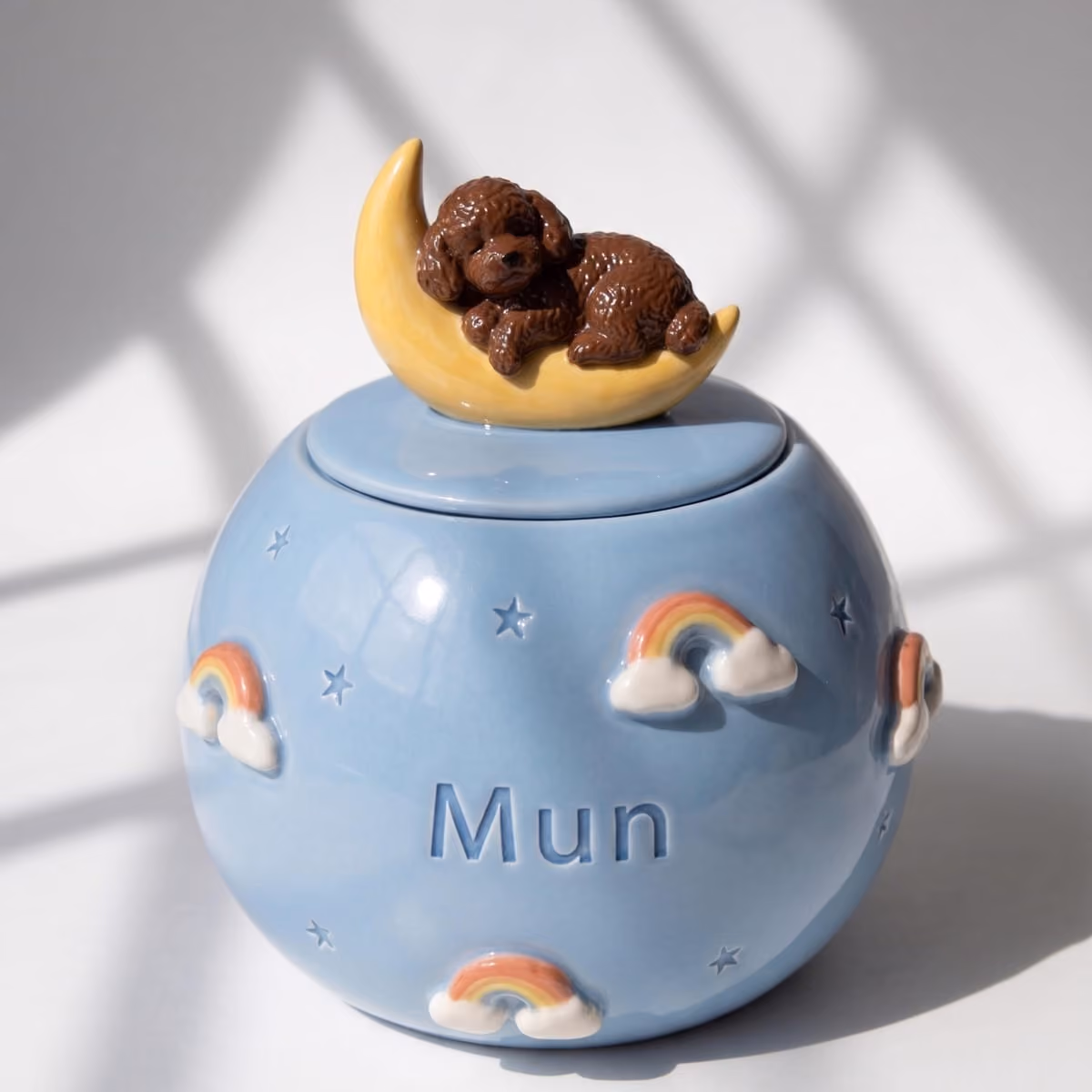 Close-up of the celestial detail on a handmade ceramic urn