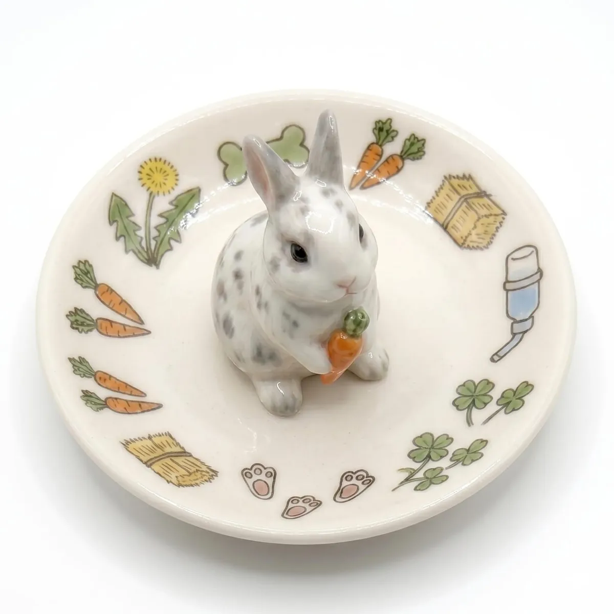 Custom 3D ceramic pet memorial dish with sculpted bunny figurine holding carrot and hand-painted botanical motifs