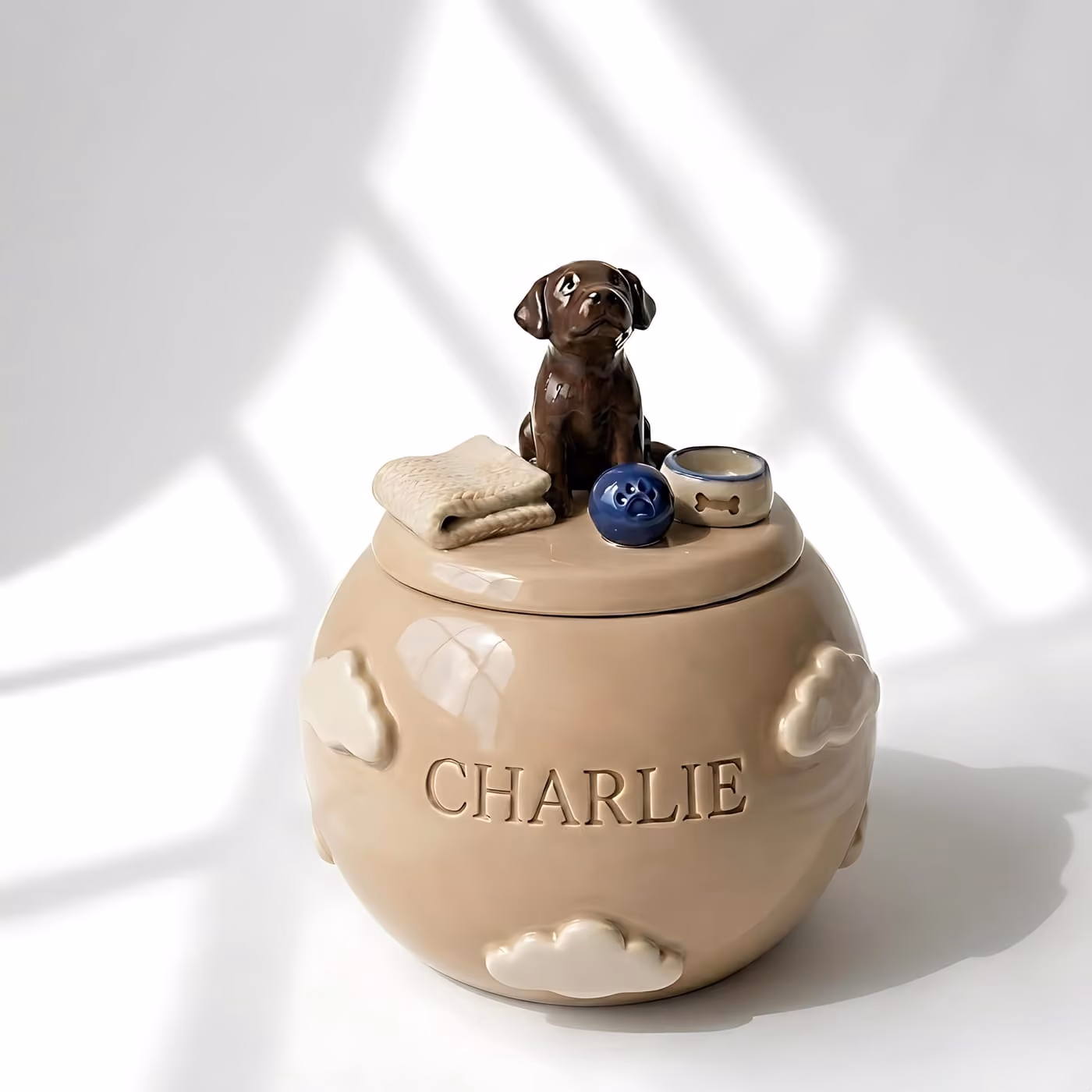 Ceramic pet urn shown from another angle, with painted floral detail