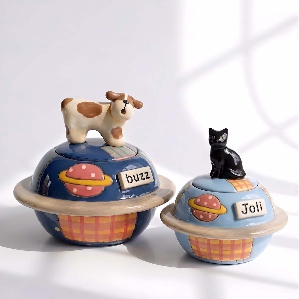 Planet & Space pet urn shown next to a hand for scale