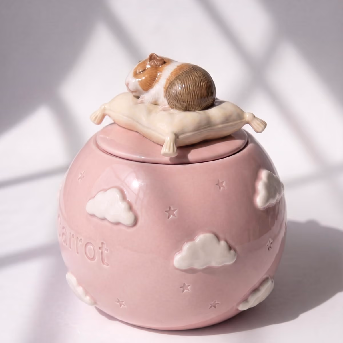 Close-up of the sleeping cloud detail on a handmade ceramic urn
