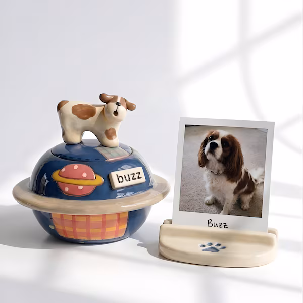 Ceramic urn with a sleeping poodle figurine resting on a sculpted cloud
